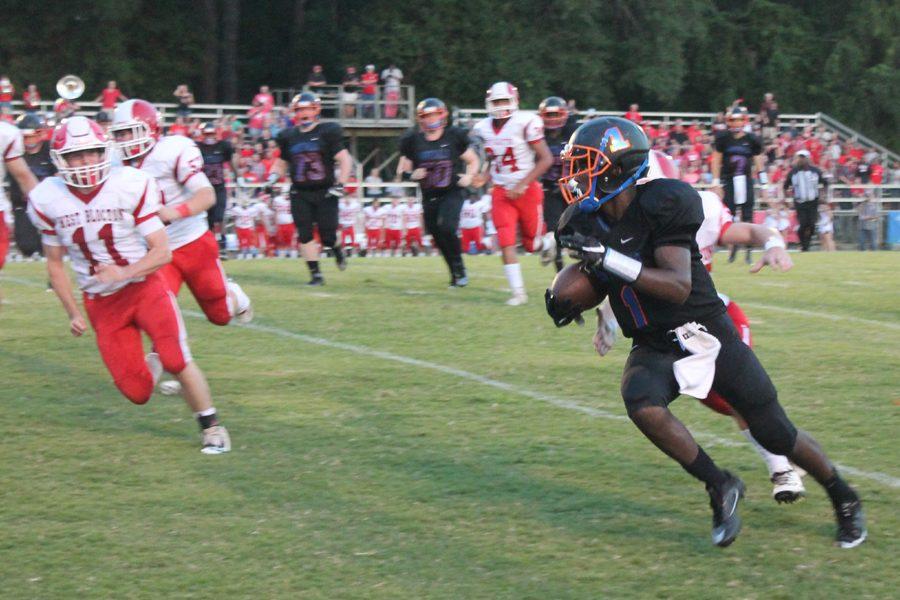 Junior Daqwan Bryant runs the ball against the Tiger defense.  Bryant later had in a interception for the Bulldogs.