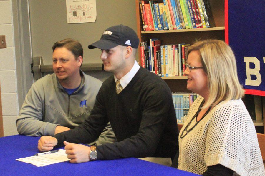 With his family, friends, coaches and teammates looking on, senior Zac Oden commits to play football with Northeast Mississippi Community College.